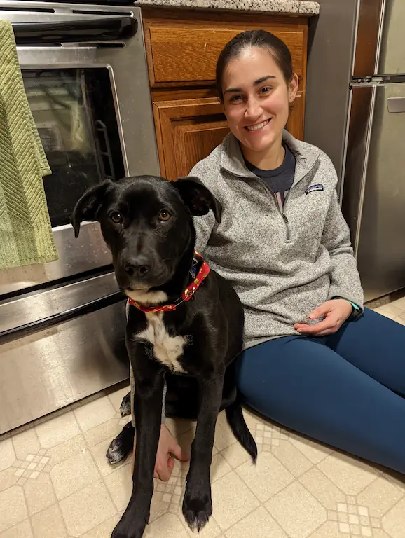 Danielle and Gracie sitting on the kitchen floor together.