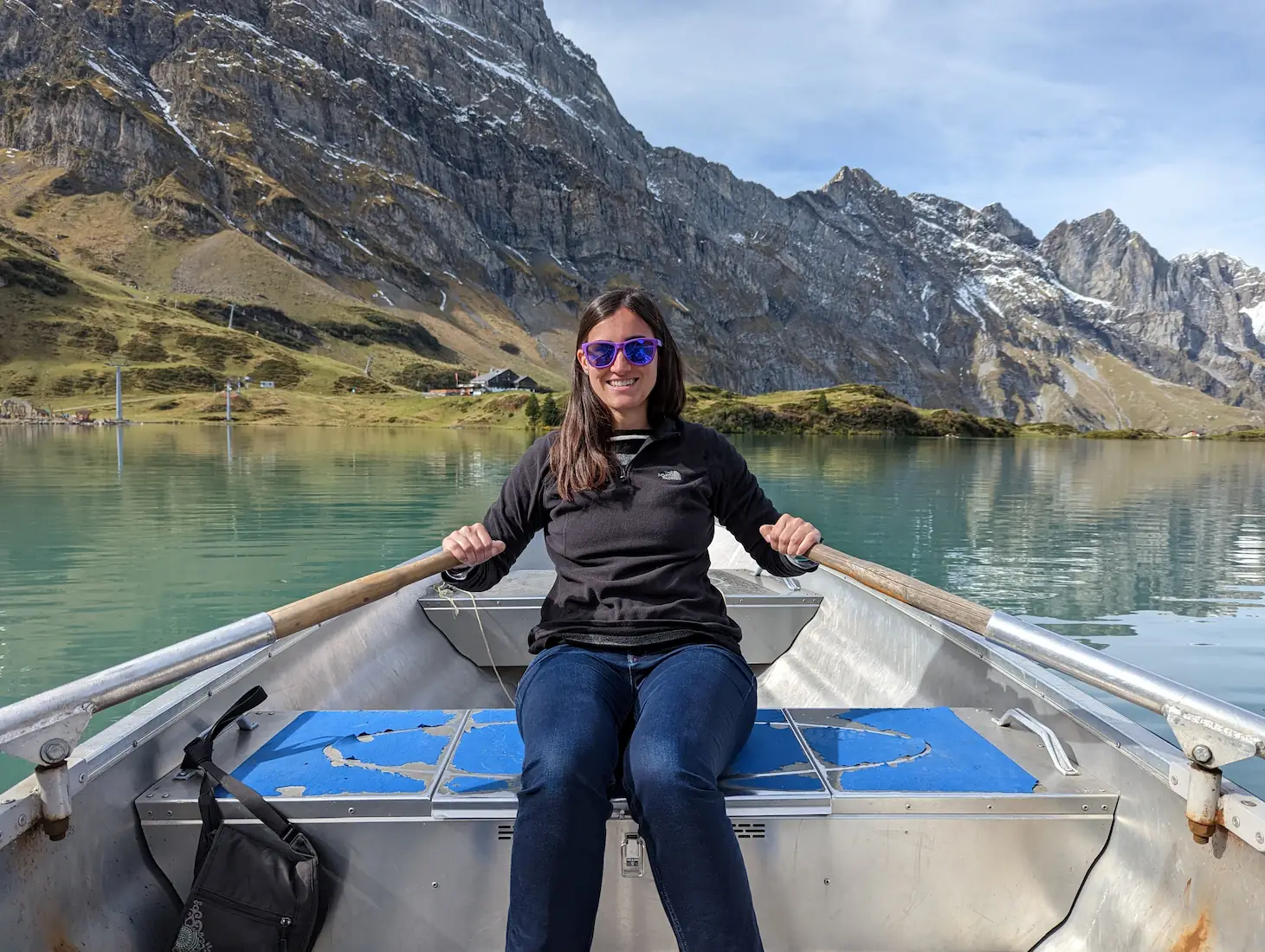 Danielle rowing a boat out to the center of Lake Trubsee in Switzerland.