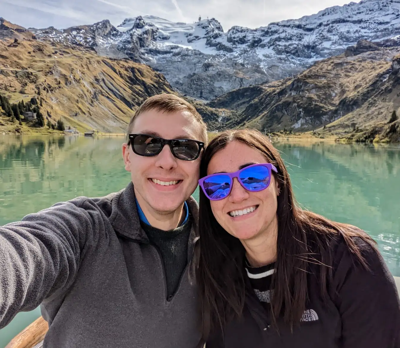 Danielle and Quentin when they got engaged, on a turquoise lake in front of Mt. Titlis in Switzerland