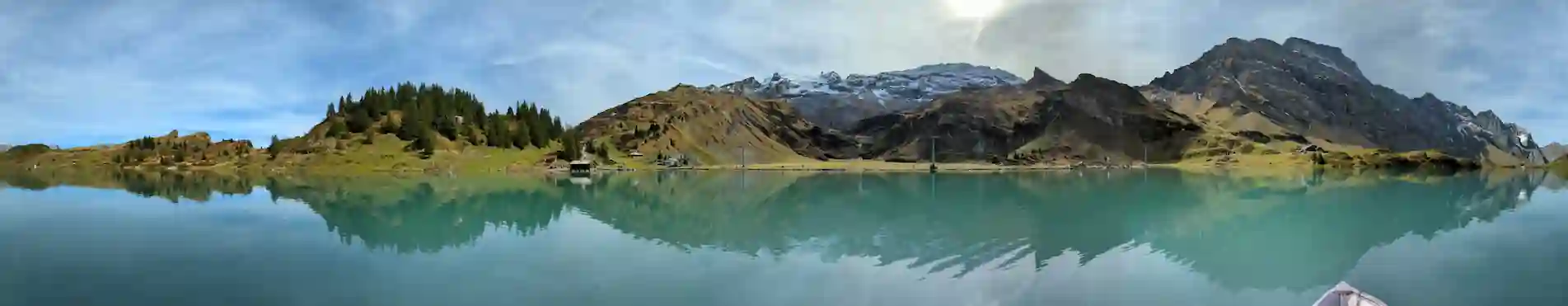 Blurred background panorama image of turquoise Lake Trubsee in Switzerland