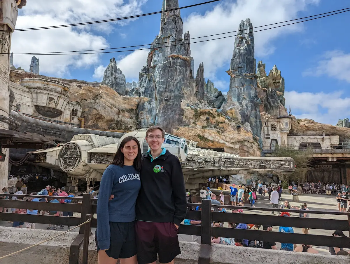 Danielle and Quentin at Disney with the Millenium Falcon behind them