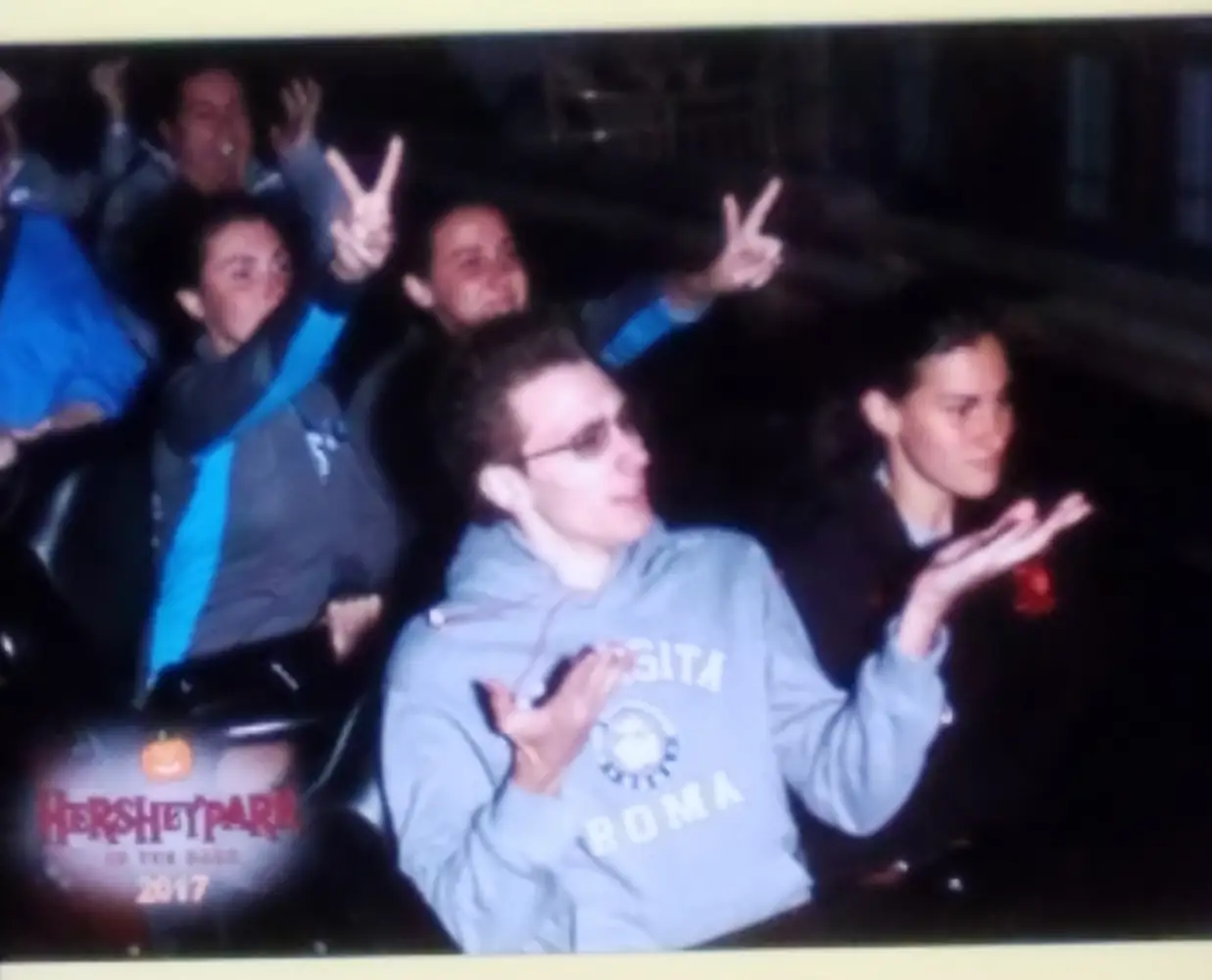 Danielle, Quentin, and Danielle's sisters Megan and Emily on a rollercoaster at Hershey Park, PA.