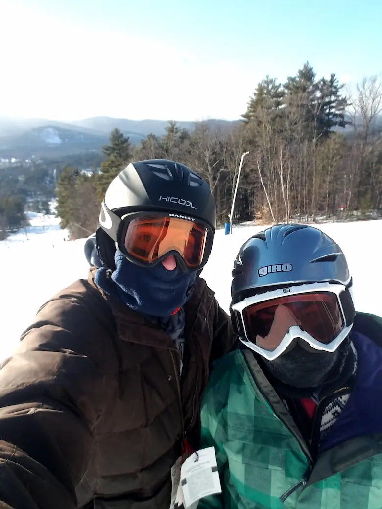 Danielle and Quentin in full ski gear on the mountain.